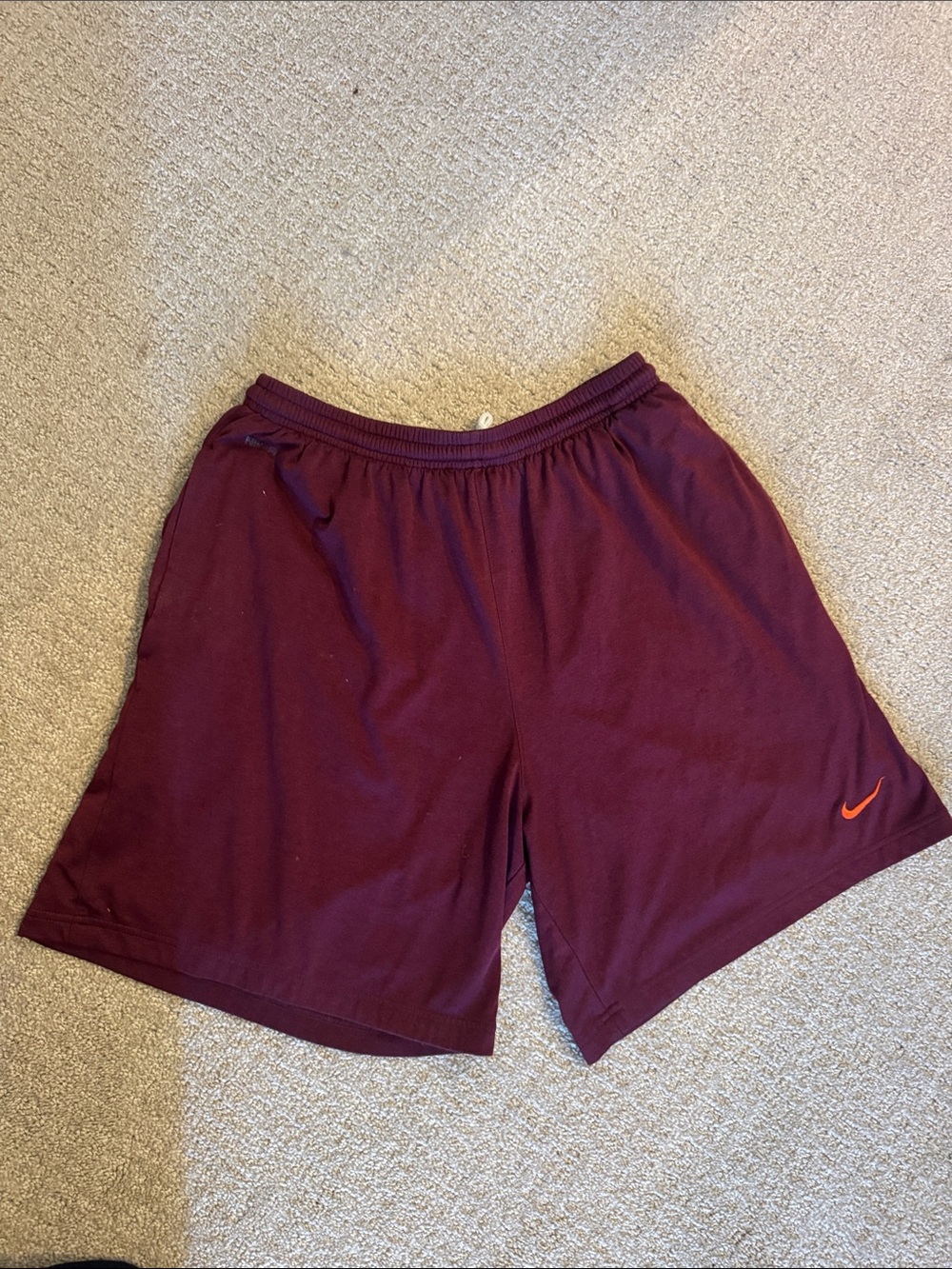 Nike Burgundy Athletic Shorts with Orange Swoosh